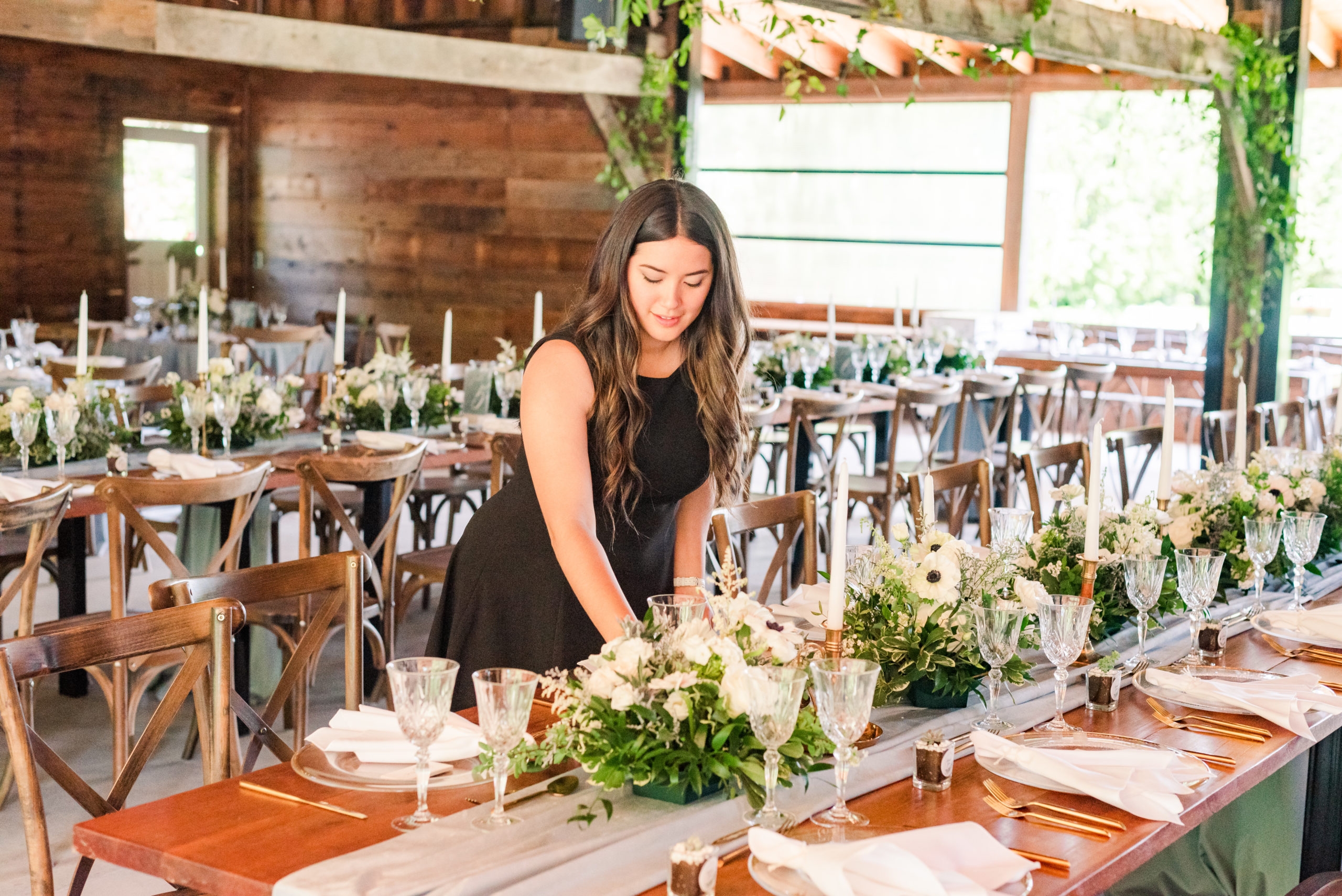 ally from perfectly designed events setting a table for a wedding at cranberry creek gardens