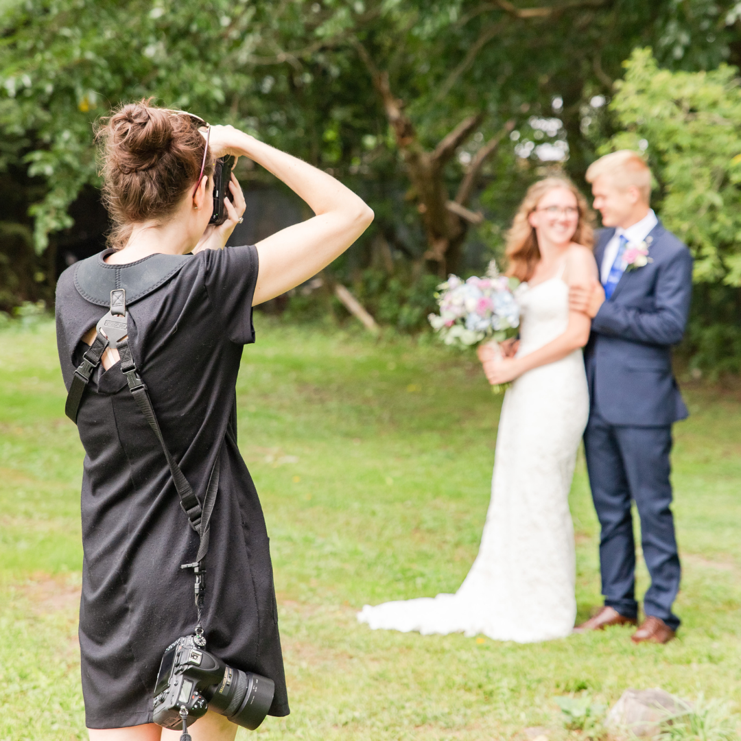 sandra henderson of life is beautiful photography takes a photo of a couple on their wedding day