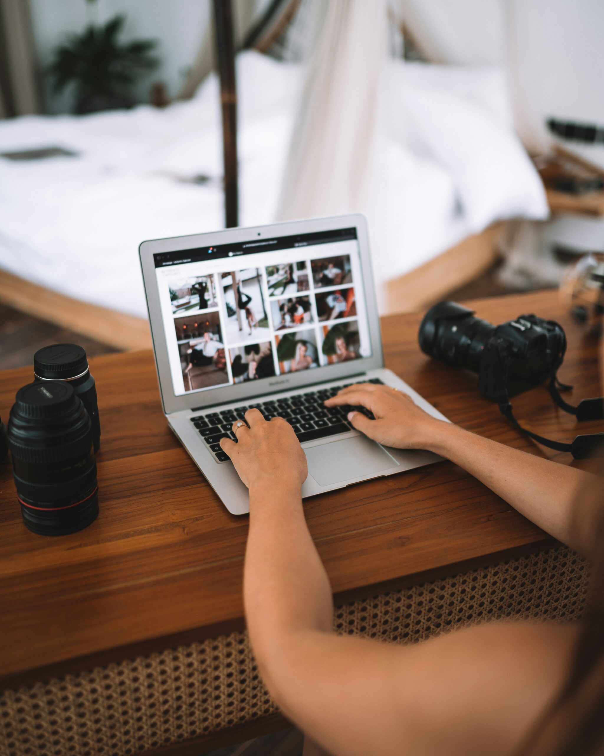 a woman types on a laptop. used in a blog post about preparing your honeybook for taking time off
